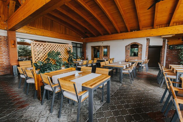 [fpdl.in]_outdoor-restaurant-with-wooden-chairs-tables_181624-57563_normal